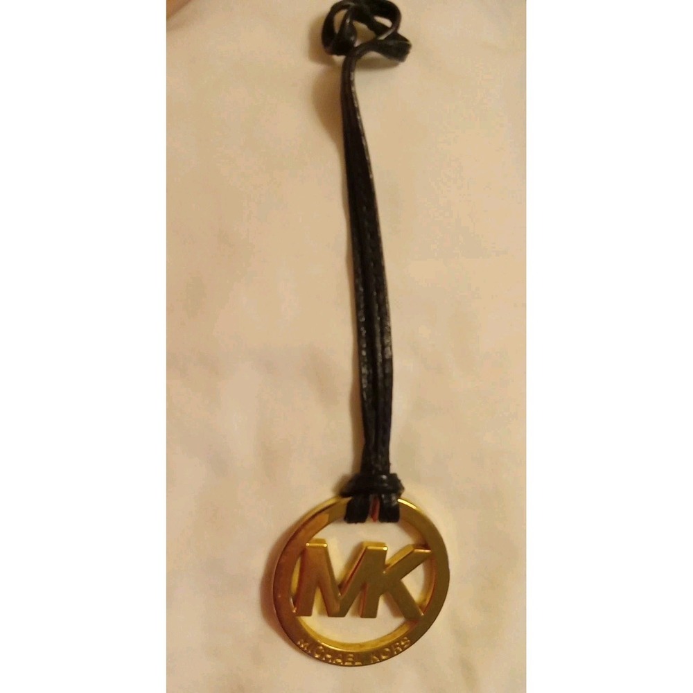Michael Kors Gold Tone MK Logo Charm Hang Tag Luggage color Leather Strap